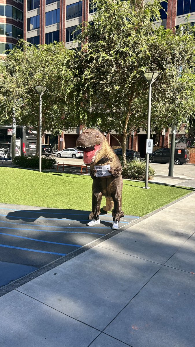 GetDelightAI's tweet photo. There's a dinosaur handing out free coffee at 200 Howard St right now. ☕ 🦖 

His name is Zen Deskosaur. He's been on hold for 66 million years, so he knows a thing or two about bad support.

We're at Urban Park until 2pm for #SFTechWeek. High fives are also free.

#SFTechWeek #CustomerExperience #CX
