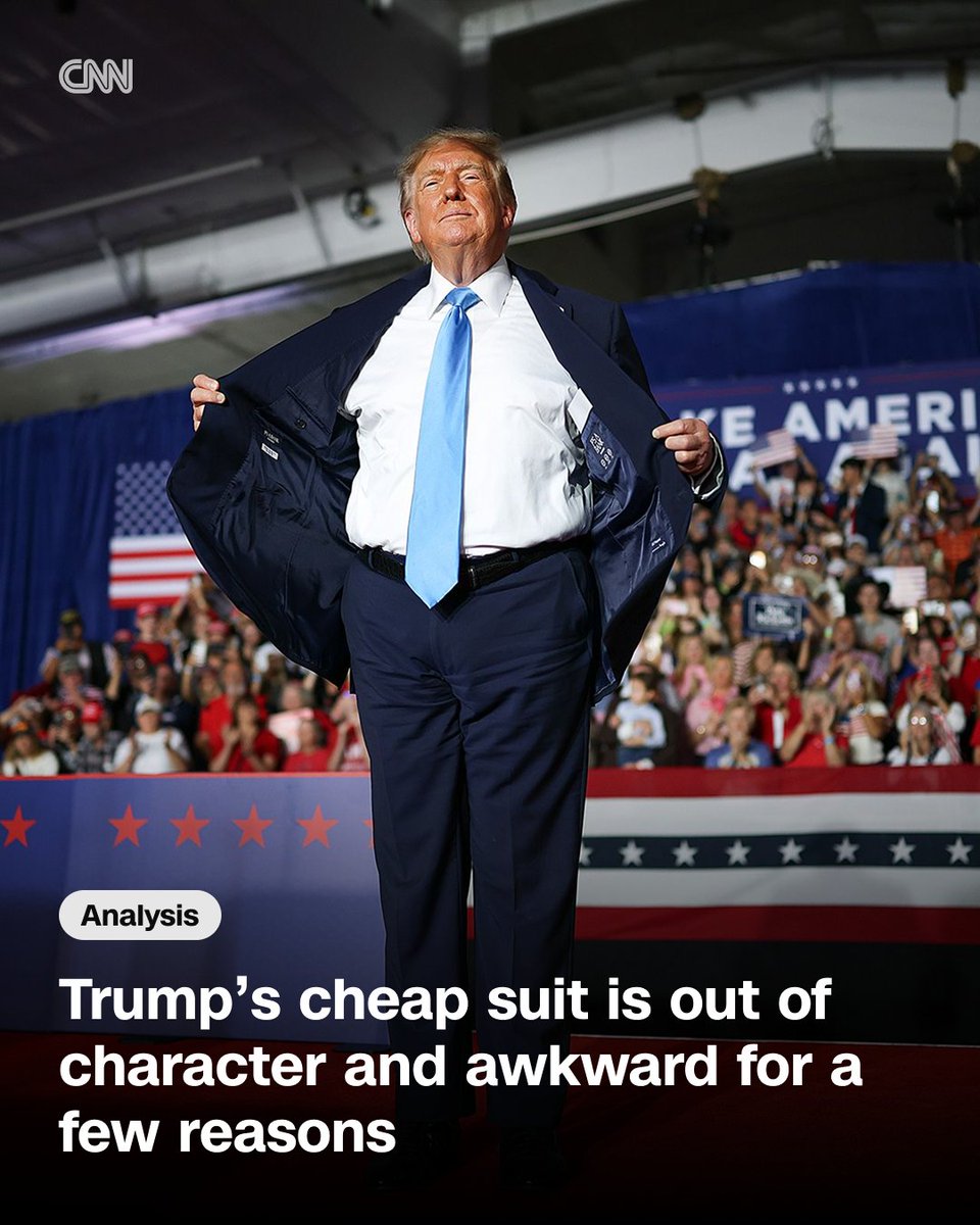 CNNPolitics's tweet photo. "The fact that Trump, a billionaire, was photographed wearing a suit jacket with tags from Jos. A. Bank, the relatively inexpensive brand, is interesting for a number of reasons," writes CNN's Zachary B. Wolf. | Analysis: https://t.co/Cki5uAAmyg https://t.co/TqKyQS4k6n