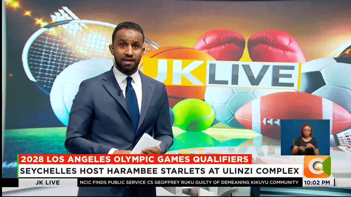 A male news anchor in a suit presents "JK Live" on Citizen TV, with a vibrant sports-themed backdrop featuring tennis rackets, boxing gloves, and balls, while on-screen text announces the "2028 LOS ANGELES OLYMPIC GAMES QUALIFIERS: SEYCHELLES HOST HARAMBEE STARLETS AT ULINZI COMPLEX," matching the post's coverage of the upcoming match.