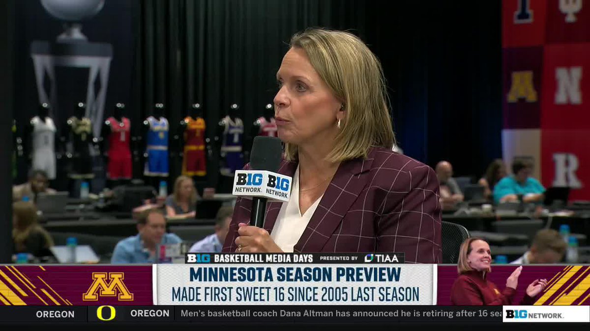 A female sports reporter holds a Big Ten Network microphone during Basketball Media Days, with on-screen text reading 'MINNESOTA SEASON PREVIEW: MADE FIRST SWEET 16 SINCE 2005 LAST SEASON' and an Oregon vs. Oregon ticker at the bottom.