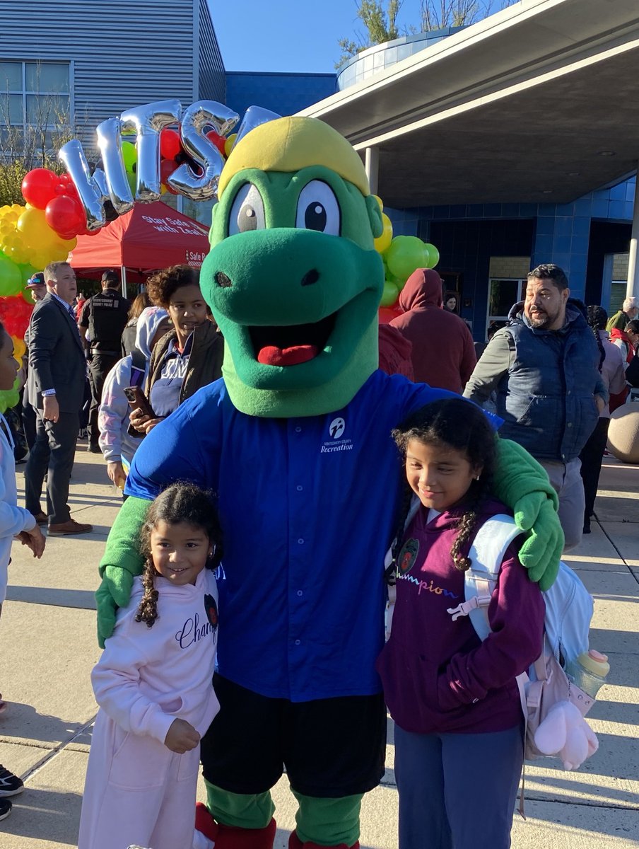 MoCoRec's tweet photo. Our very own T-Rec had an awesome time today joining @MCDOTNow's Zeal the safety Zebra, @mcfrs' Sparky and countless excited students at Walk &amp; Roll to School Day at Glenallan Elementary School to help promote safe travel! 🏫 #MoCoRec @MCPS https://t.co/32YoQrEcKR
