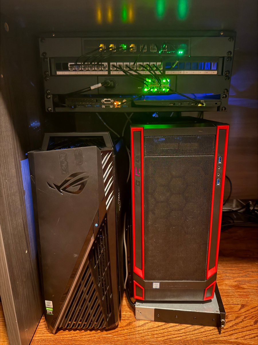 taylorhbuilds's tweet photo. I'm weirdly proud of my very cheap but also very effective homelab.  Each machine has a purpose. 

Yes, I do have a noctua fan ziptied to the bottom of my desk pushing hot air out of the cable management hole in the top of my desk. I'm proud of my ingenuity. 

The ROG desktop is an old recycled PC that is just running linux, it's where all my codex/claude/cli agents live and it's always on, always running. 

The red outlined desktop is a nas, running truenas. Yes, it is sitting on top of a rack mountable ups, i just have no rack to mount it too. 

There's an old x1 carbon between the two desktops, that is my "browser machine." It runs debian, has 4 Chrome windows on it exposed to my tailscale network that all my agents can use for real actual access to a browser/the internet. 

The Lenovo tiny is dns box #1, running adguard, and monitoring all the other machines using grafana/prometheus. 

The t460s next to the tiny is dns box #2, running redundant dns/adguard plus monitoring via grafana dns-01. 

No pictured - windows machine with 7950x/3090 for running local models (originally my gaming pc) and my macbook pro that is basically just a window into all these machines now. 

The top switch is a $165 10GbE switch off Amazon to give me a 10GbE backbone. The bottom switch is 1GbE for other devices.