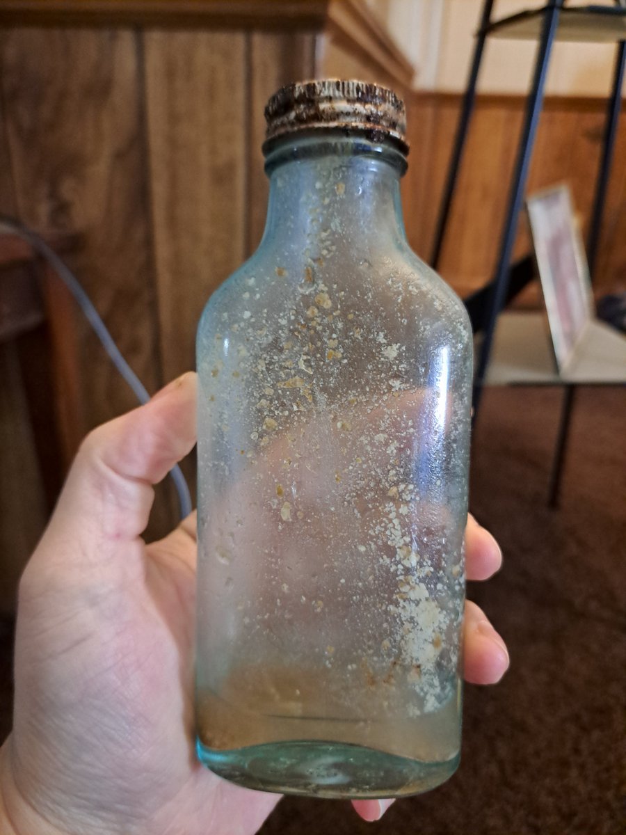 NowWithCody's tweet photo. Found this old bottle from the 1930's in the creek with the cap on and a small amount of mystery liquid with little chunks inside. 100 reposts and I'll pop the top and taste it on video. https://t.co/FMTOCakvXU