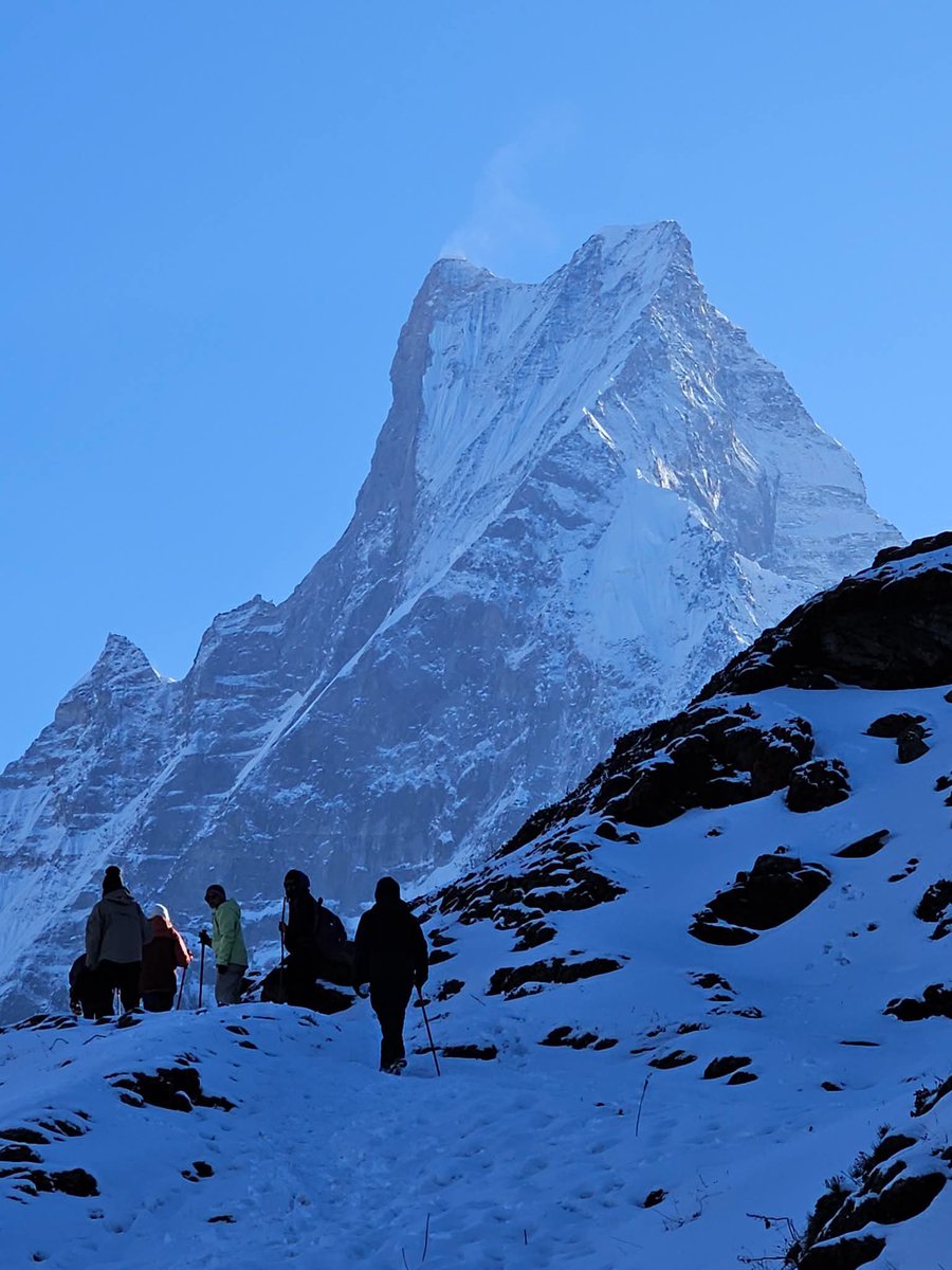 Meharjan555205's tweet photo. Trekkers keep pushing along the snowy Mardi Base Camp trail toward their destination, with the majestic Mt. Machhapuchhre towering dramatically ahead. 🏔❄
#jammukashmir
#bigboss #tejran
#karuppu #spiritualawakening https://t.co/CTauhLxwO9