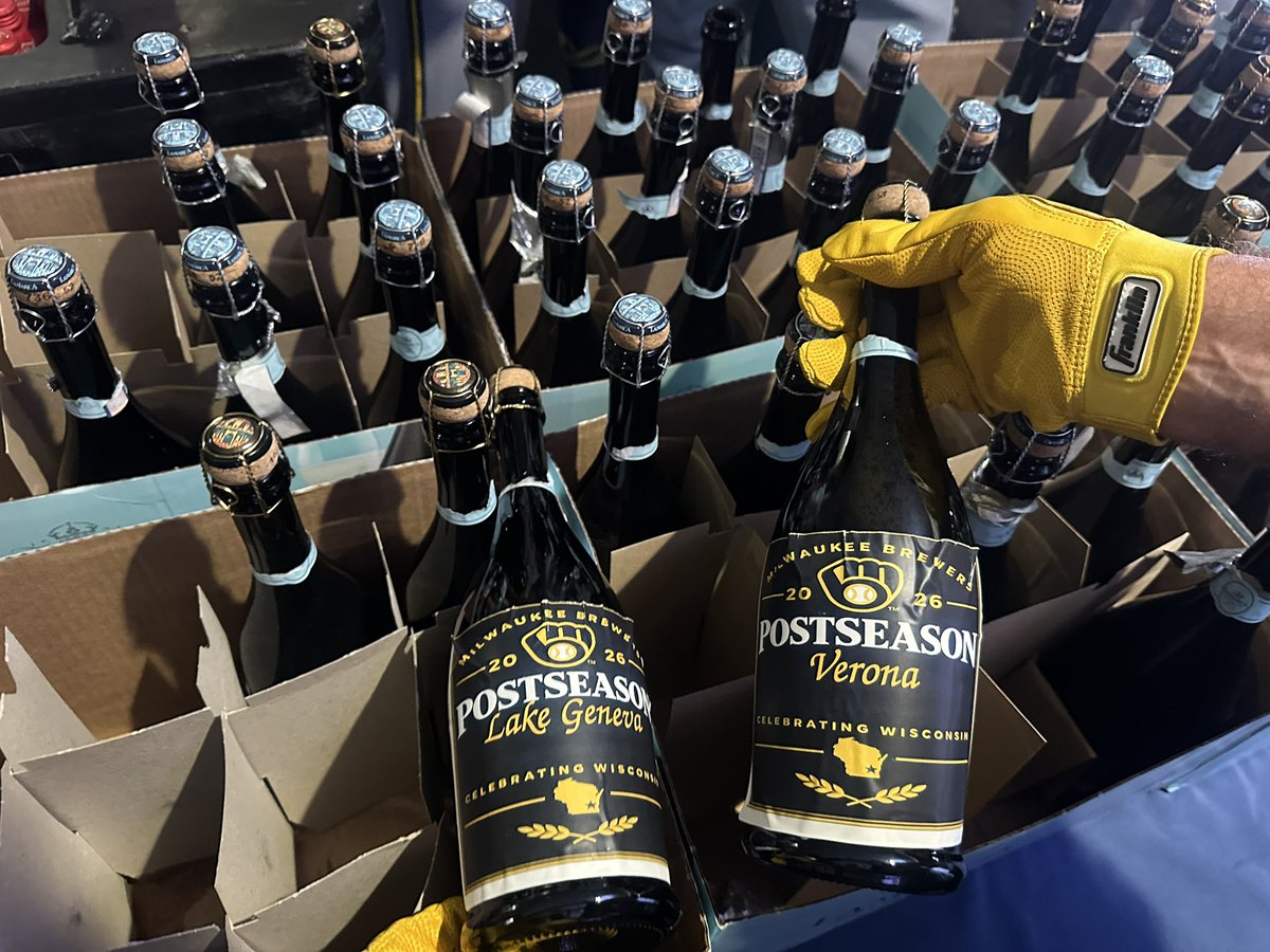 SophiaMinnaert's tweet photo. The Brewers champagne bottles have the names of Wisconsin towns on them just like the flag they travel with on the road. 💙💛 https://t.co/mPo9BIpRRb