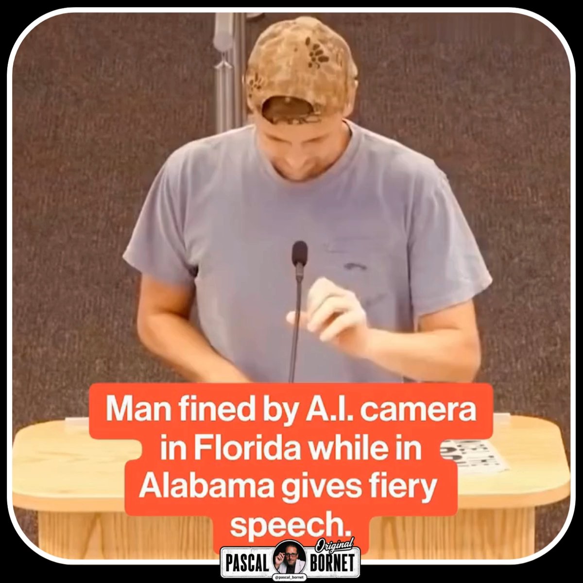 A man in a backwards cap and gray t-shirt speaks at a podium, with overlaid text reading: 'Man fined by A.I. camera in Florida while in Alabama gives fiery speech,' branded by 'Pascal Bornet Original.'