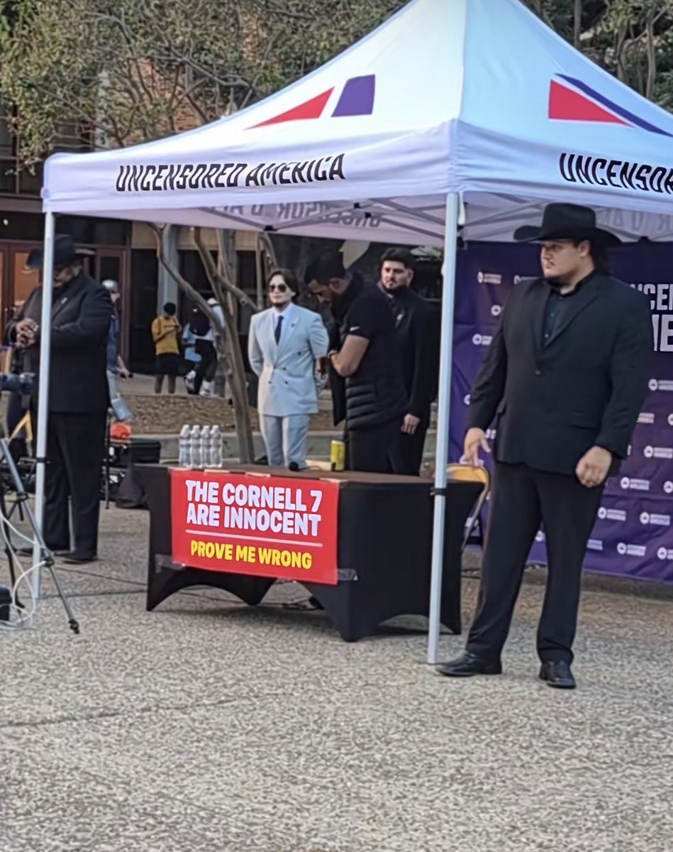 FearedBuck's tweet photo. Myron Gaines pulled up to the University of Texas at Austin with a poster that read, “The Cornell 7 Are Innocent. Prove Me Wrong.” https://t.co/v0dyt7BVwI