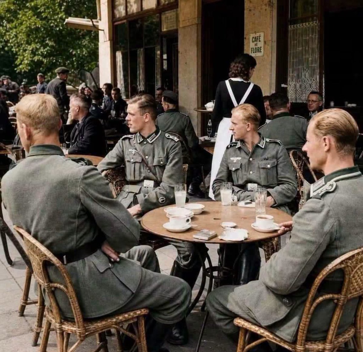 TheAxisCampaign's tweet photo. ☕️ German Wehrmacht officers sit outside the famous Deauville Café on the Boulevard Saint-Germain in Paris.

Paris, France, 1940. https://t.co/qUKwWTxGYz