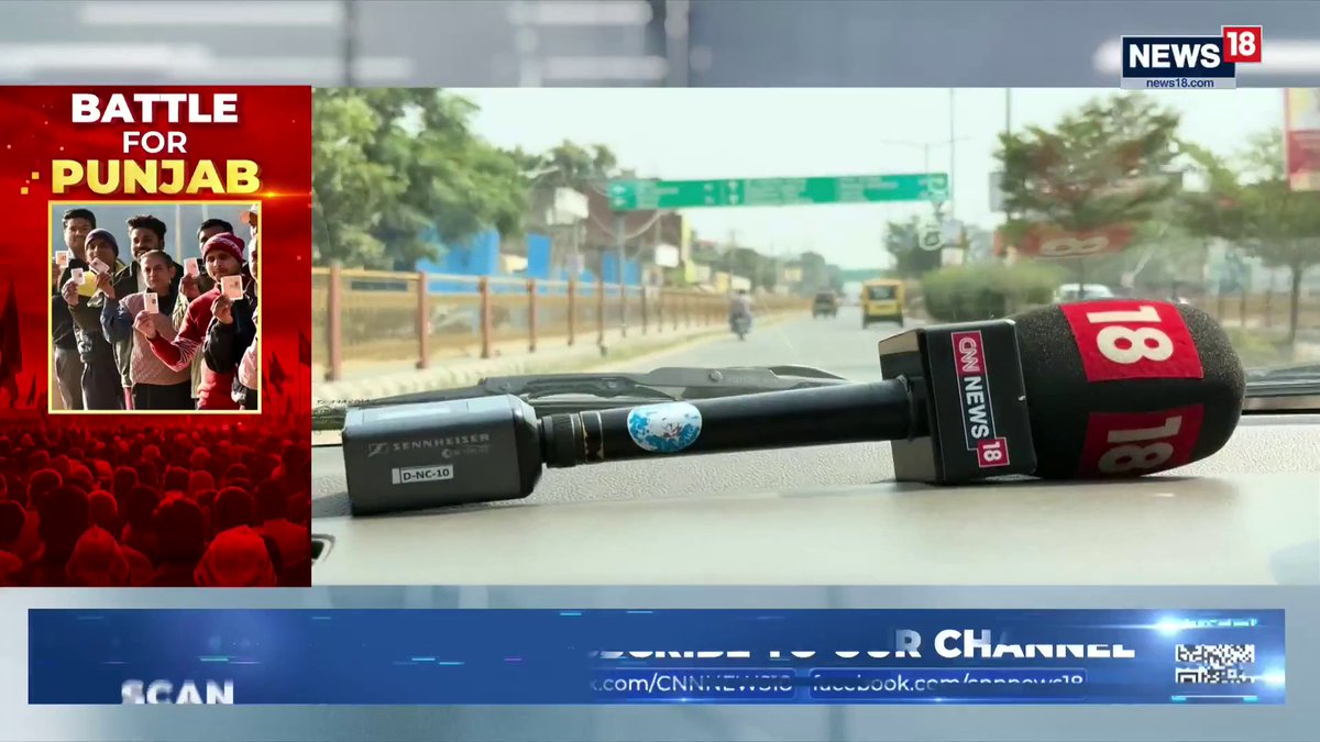 A CNN News 18 broadcast titled 'BATTLE FOR PUNJAB' shows a microphone resting on a dashboard overlooking a road, with an inset image of people holding voter IDs.