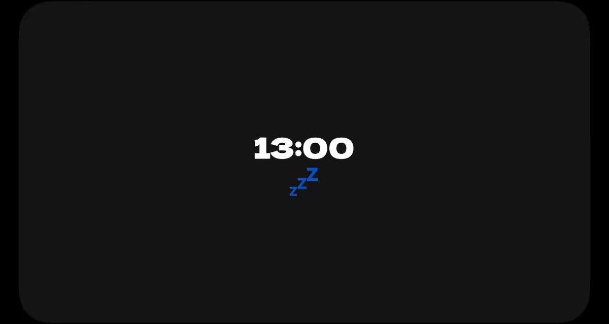 A simple dark screen displaying the time '13:00' with blue 'zZz' sleep symbols.