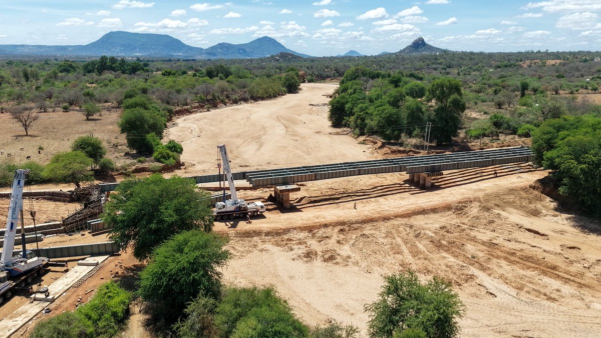 KeRRA_Ke's tweet photo. Construction of Enziu Bridge and Approach Roads!

We are back with another progress status update on the Enziu Bridge and Approach Roads Project in Kitui County.

Good progress continues, with 10 out of the 15 girders successfully erected, marking a significant milestone in the ongoing construction works. The project remains on course towards enhancing connectivity, improve access to essential services and economic opportunities for the community around. 

#KeRRAikoWorks