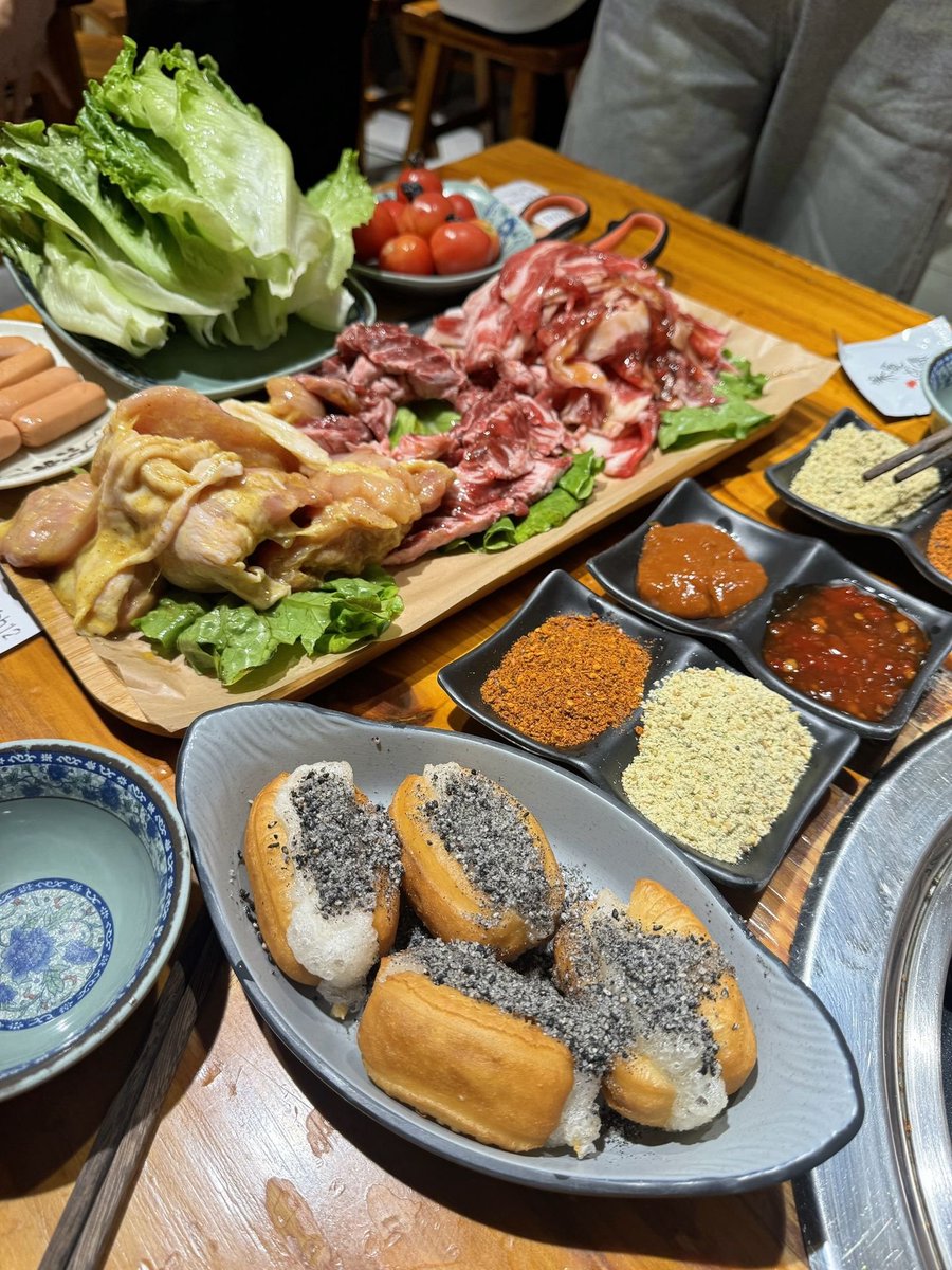 sweetiesprite's tweet photo. Chinese charcoal barbecue night! Raw meat ready to grill, skewers over open fire, plus crispy fried dough stuffed with sticky rice. When smoke fills the table, all worries disappear 🥩🔥#ChineseBBQ #GrillNight https://t.co/ipRbNwCUdK