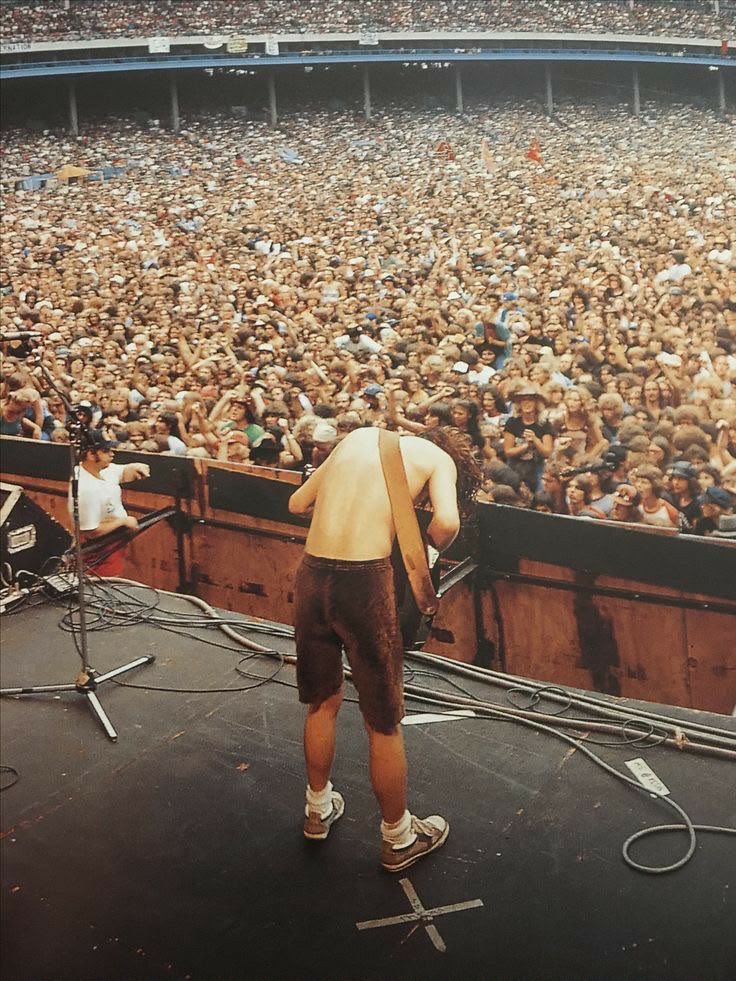 BrianJ2_n8's tweet photo. 🤘 Angus Young in the 80s, feeding off a massive AC/DC crowd! ⚡️🔥 Those crowds were LOUD, wild, and ready to rock! 🎸
If you could go back and see AC/DC in the 80s, which song would you want to hear live? 🤘
#ACDC https://t.co/vPRze7hczH