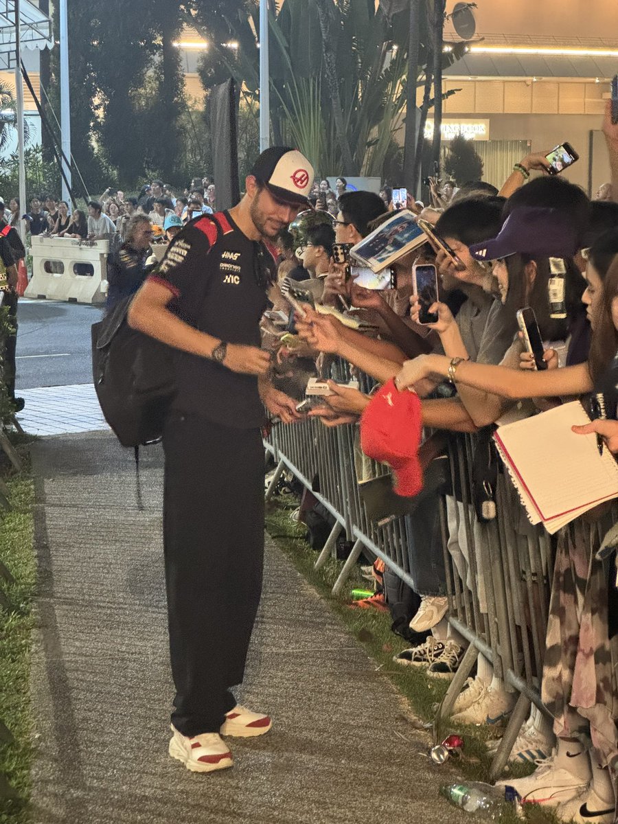 M0lly_Writes's tweet photo. Great to see Esteban Ocon (and Laurent Mekies in the background!) signing and stopping for selfies with fans late into the night - this was about an hour ago. 

Absolutely brutal conditions out there for the fans 🥵 https://t.co/B9XwgxA3jt