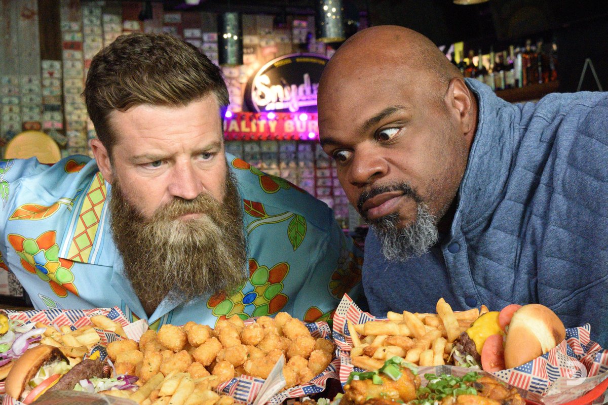 Discovery's tweet photo. Two NFL legends. One massive appetite. 🏈🍔 Ryan Fitzpatrick and Vince Wilfork take their competition from the field to the plate in the all-new #MenVFood. Coming soon to @Discovery. https://t.co/p4Gy7iVXlv