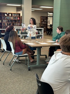 HumbleISD_KPHS's tweet photo. A little taste of many great books! 📚 Ms. Castille’s ELA 2 students are exploring new reads during a Book Tasting in the library. We can’t wait to see which titles they choose! #WeAreKPark https://t.co/SXH3zl8fIK