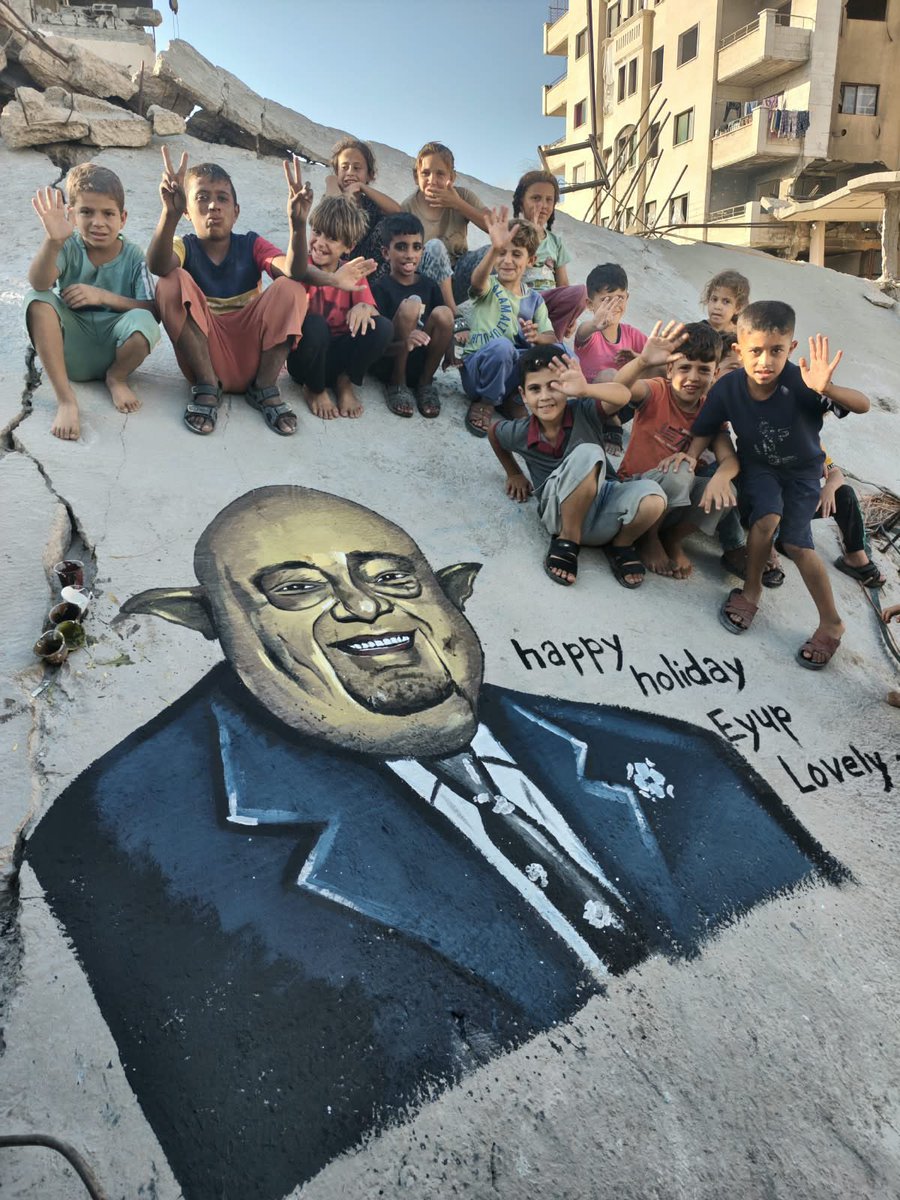 ProjectMuhmmed's tweet photo. My dear brother Eyup Lovely @eyuplovely 🤍🎂

For your birthday, we wanted to give you something from our hearts. So we decided to paint our gratitude on the walls of Gaza itself.

The young members of Project Mohammed painted your portrait on one of the walls still standing amid the destruction—a birthday gift from the people whose lives you have touched. Here, your voice has helped bring water to thirsty children, bread to hungry families, and meals to people exhausted by hunger.

The war may have destroyed the buildings around us, but it could never erase the gratitude in our hearts. We wanted your portrait to remain here, among the people you stood beside during the most difficult days of their lives.

When the children see your portrait, we want them to know: “This is Eyup—a man who may be far away, but whose heart is very close to Gaza. His voice helped bring us water and bread.”

On your birthday, we hope you can feel some of the warmth you have brought into our lives. Behind every distribution you helped make possible are families who may never have met you, but who have felt your kindness in something as real as a meal shared with their children.

You helped the world see and hear us.
You stood beside our young team.
And you gave others a reason to stand beside us too.

From the children of Gaza, the young members of Project Mohammed, and the depths of our hearts: happy birthday, brother. May the year ahead bring you kindness, friendship, and many reasons to smile.

Please accept this mural as a small gift of love from Gaza. Your impact will remain in our hearts—even if these walls disappear one day. 🤍🇵🇸

If you would like to celebrate Eyup’s birthday with us, help continue the work he has supported. Every donation helps us bring more water, bread, and meals to families in Gaza.

Support Project Muhammed directly:

https://t.co/3XNk966DjQ