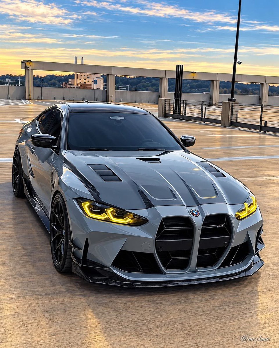TerryMackTorque's tweet photo. Golden Hour Grey -This M4 Doesn't Need a Filter 
Brooklyn Grey G82 M4 Competition with vented carbon hood, full carbon lip and yellow CSL DRLs. Same garage, different monster. Sunset in Texas hits different when you have 510HP

Which DRL do you prefer on this grey - Red or Yellow https://t.co/U6Tu1UcXrw