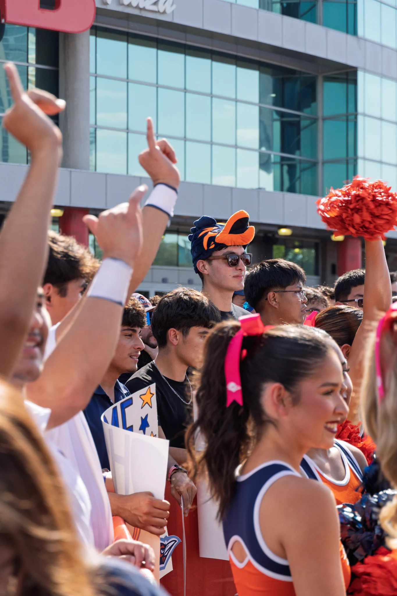 Fans cheer and put their birds up.