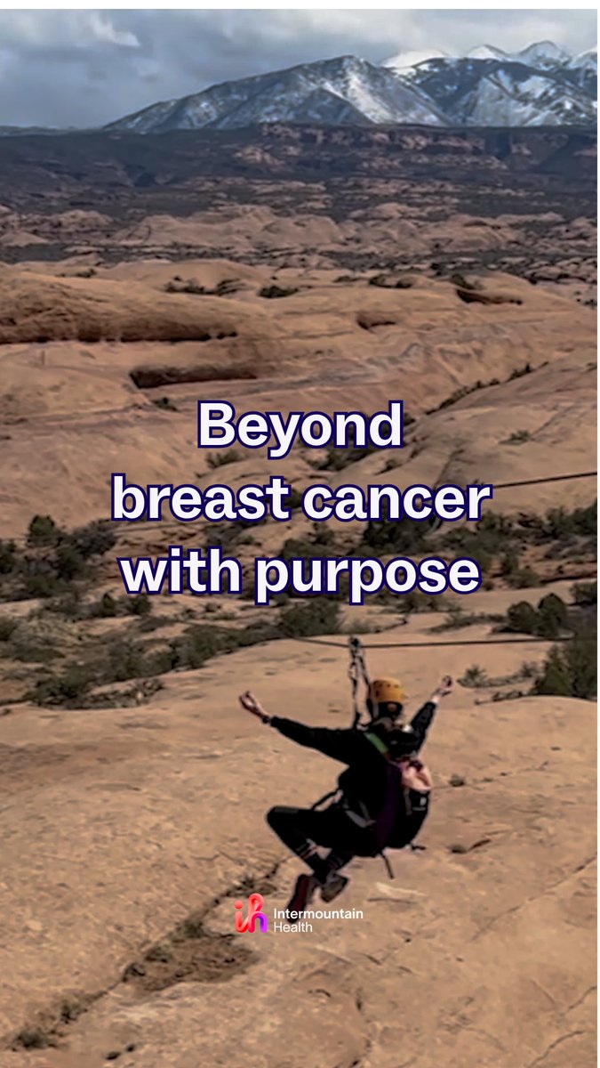 An Intermountain Health advertisement shows a person zip-lining across a desert landscape with snow-capped mountains in the background, overlaid with the text 'Beyond breast cancer with purpose'.