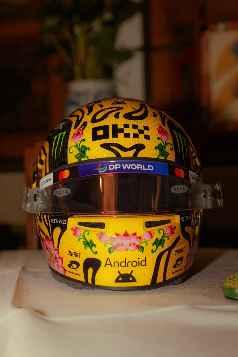 LN4's tweet photo. An unreal Singapore helmet for @LandoNorris this weekend 🪷 a special one celebrating Peranakan artists and culture 👏 https://t.co/uaBVpmwVFG