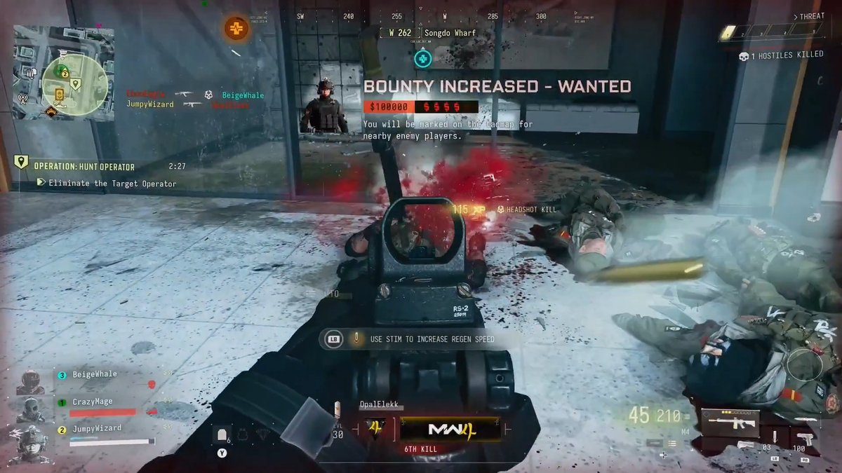A first-person Call of Duty: Modern Warfare II DMZ firefight shows the player aiming an RS-2 at a downed enemy in a snowy industrial area, with bodies, blood, and dropped gear on the floor. The HUD displays “BOUNTY INCREASED - WANTED,” “$100000,” a “8 HEADSHOT KILL,” “6TH KILL,” “45 210” ammo, and squad names Beigehale, CrazyMage, and JumpyWizard, illustrating PvP gameplay.