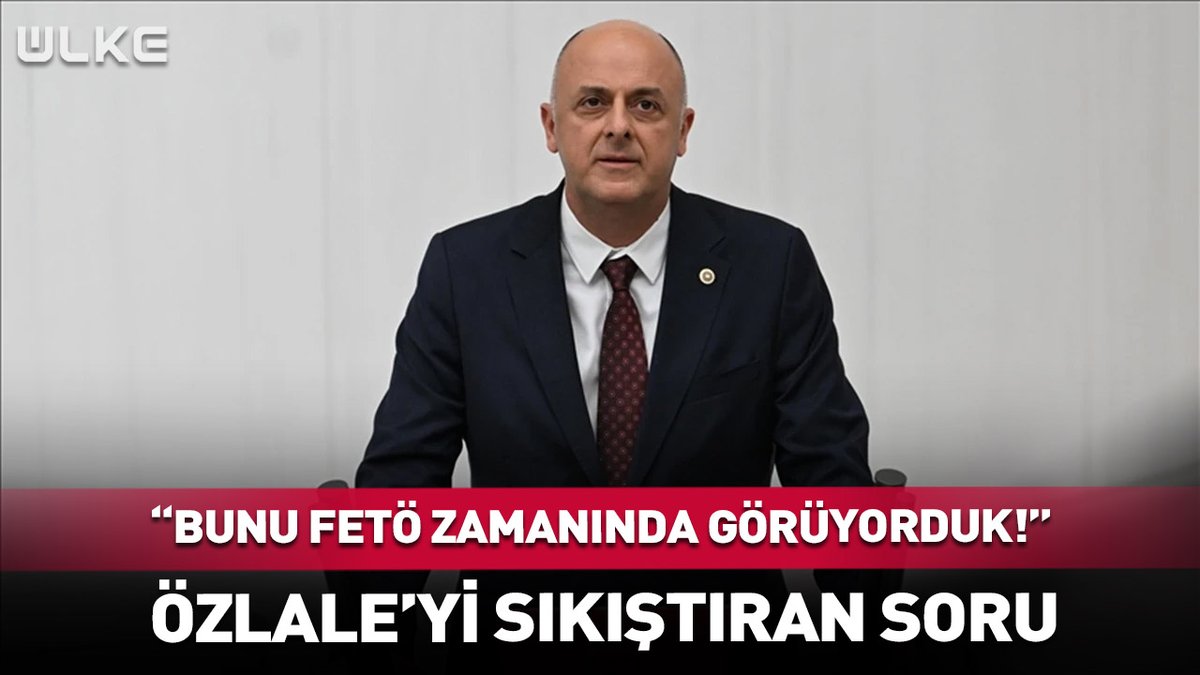 A Turkish news thumbnail from ÜLKE showing a bald man in a dark suit and red tie, with text 'BUNU FETÖ ZAMANINDA GÖRÜYORDUK!' and 'ÖZLALE'Yİ SIKIŞTIRAN SORU'.