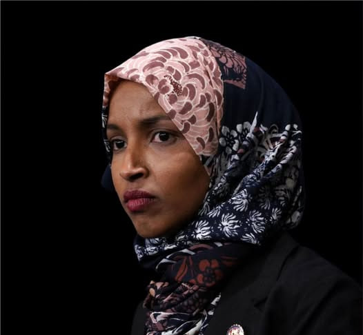 SaveAmericaNew's tweet photo. Ilhan Omar will have to reapply for citizenship, according to an order from the 4th District US Immigration Court.

"She was granted citizenship as a minor child of a naturalized person, but they lied about her age," said Immigration Judge Jeb Narroo, "Since she was 18 at the time, she's required to apply herself."

The court gave her 30 days to complete the process legally, otherwise her citizenship will be stripped, which disqualifies her from Congress.

Omar says she's appealing the decision.

What's your response to this......??👀

MAKE THIS GO VIRAL ON X. LET’S GO 👏