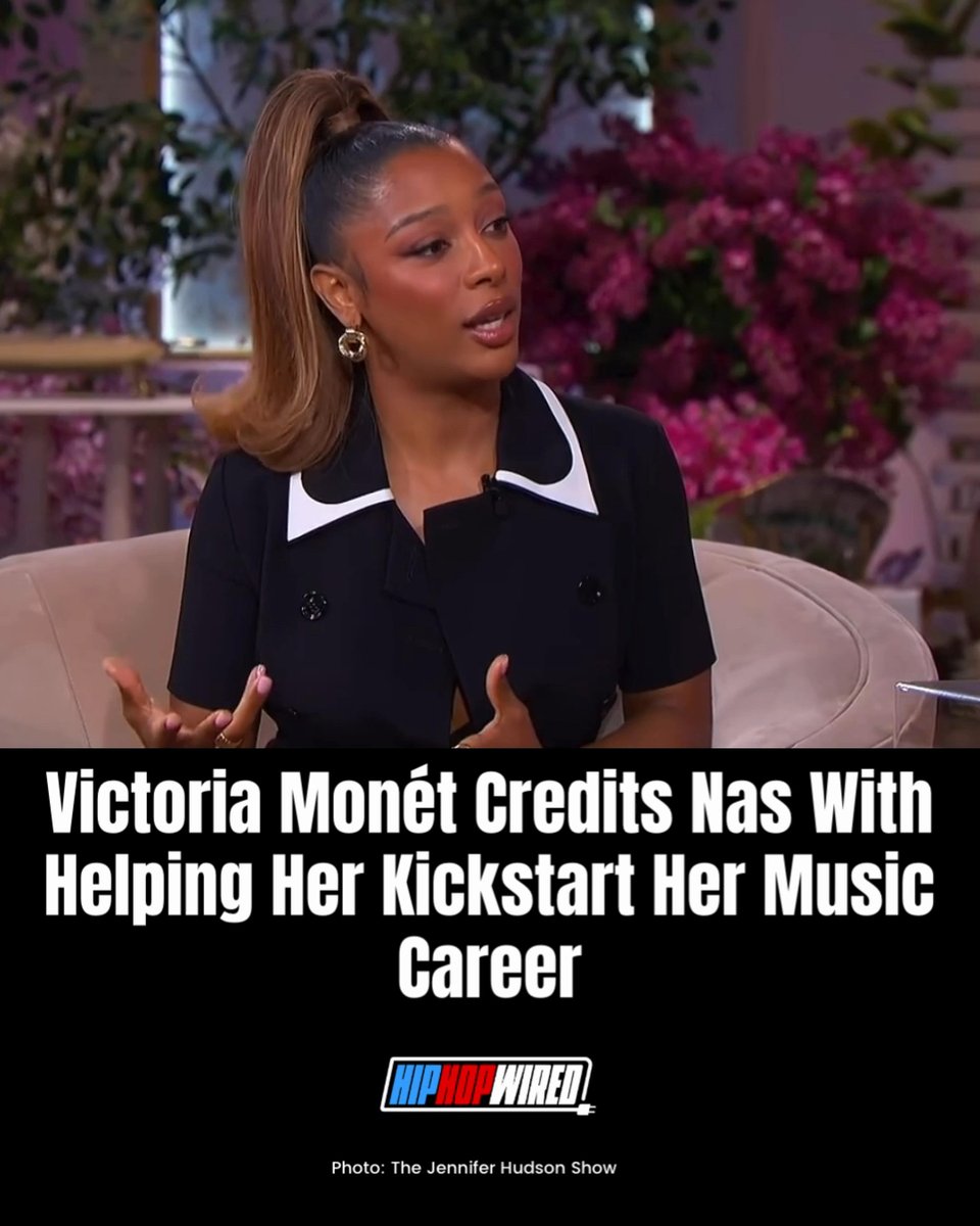 Victoria Monét appears on a talk show couch in a black blazer with white collar trim; the caption reads 'Victoria Monét Credits Nas With Helping Her Kickstart Her Music Career' from Hip Hop Wired.