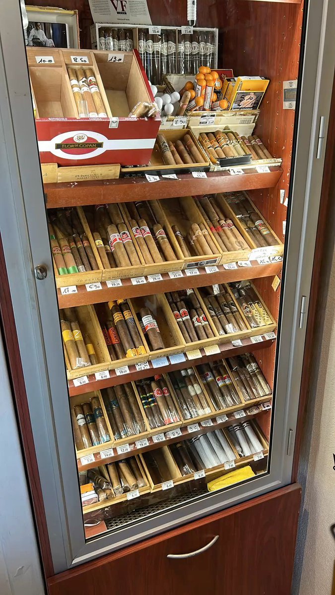 marianny_pcw's tweet photo. A commercial-grade, freestanding cigar humidor cabinet featuring slanted cedar display shelves, a full-length glass door, and a lower storage compartment for extra stock. It’s in great condition and ideal for a retail shop, lounge, or personal collection. Lmk #cigars #humidor https://t.co/TtK8MedEPW