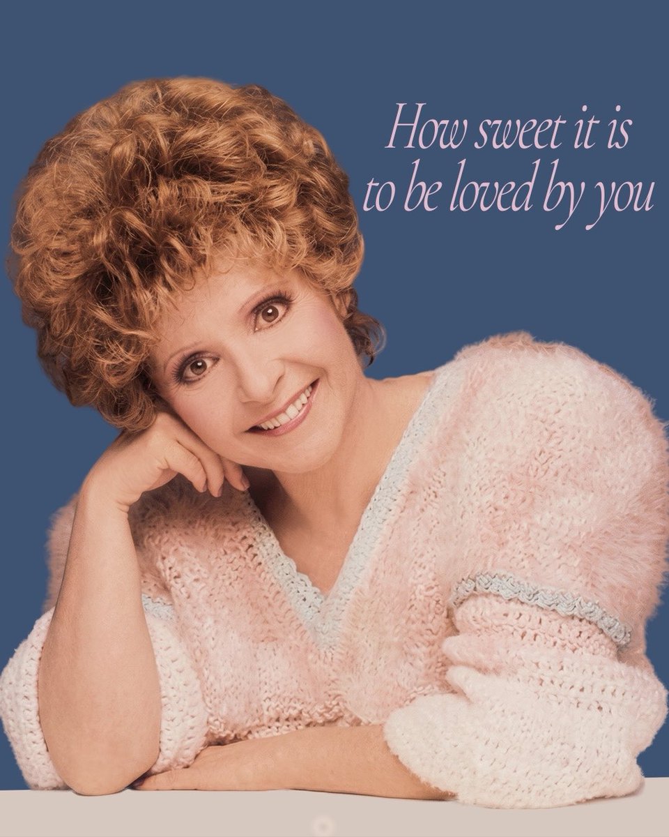 A woman with curly auburn hair wears a fuzzy pink sweater against a blue background, with elegant text reading 'How sweet it is to be loved by you'.