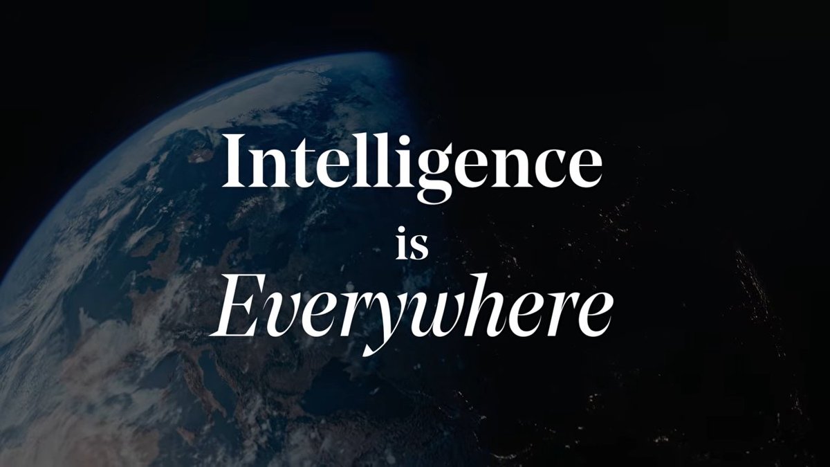 An image of Earth viewed from space with the text 'Intelligence is Everywhere' overlaid in white serif font, with 'Everywhere' in italics.