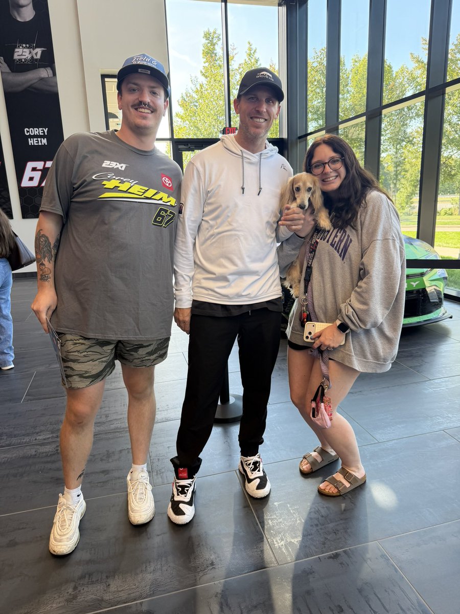 sorryimsam's tweet photo. we took cleo to 23xi and she met denny!!!! HES HOLDING HER PAWWW 🥹😭 https://t.co/G9JlaHbPZ4