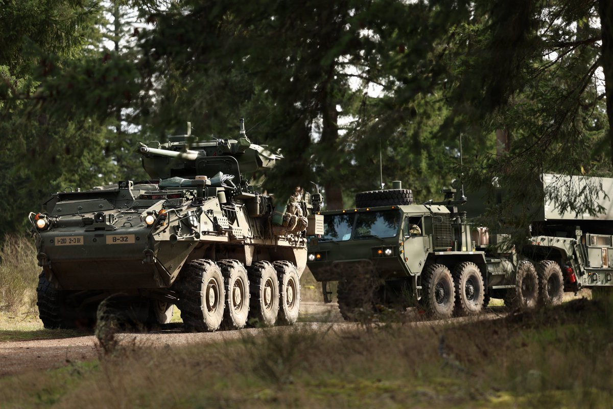 lfx160219's tweet photo. A Stryker M1304 ICVVA1-30mm assigned to 2nd Battalion, 3rd Infantry Regiment, 7th Infantry Division (Multi-Domain Command – Pacific) escorts a Dark Eagle Long-Range Hypersonic Weapon from 5th Battalion, 3rd Field Artillery Regiment (Long Range Fires Battalion), as part of Exercise Bamboo Eagle 26-1 at Joint Base Lewis-McChord, Wash., Feb. 18, 2026.source:https://t.co/giYQKkAycu