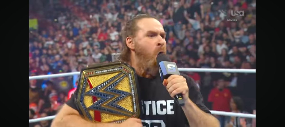 Scott_did_does's tweet photo. Sami Zayn with the title just doesn't look right. It's like a homeless bum being the WWE champion. Cut his hair and his beard at least. https://t.co/jblHh9aP69
