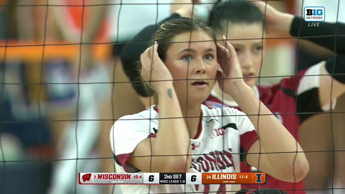 A Wisconsin volleyball player with her hands on her head is shown through the net during a Big Network broadcast, with the scoreboard reading "WISCONSIN 6" and "ILLINOIS 6" in the 2nd set.