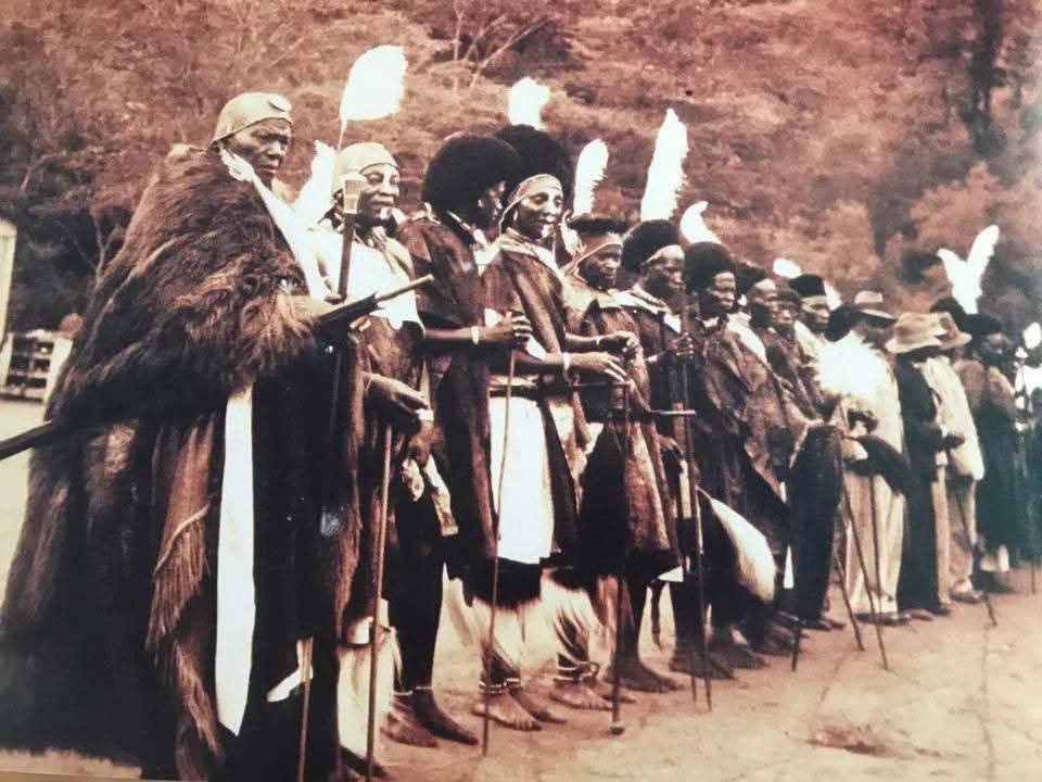 timothyturunga's tweet photo. Senior Chief Njiiri wa Karanja's son vacated the Kigumo legislative seat in 1962 so Kenyatta could enter Parliament. The "debt" was recently repaid the government allocated Sh340 million for Kangari market upgrade. Sixty years later.

Chief Muhoho wa Gatheca was father to Mama Ngina Kenyatta's wife. His son George Muhoho became Education Minister, Tourism Minister. Another son, Paul Gathecha, got entangled in the NYS corruption scandal. The family tree grows through scandal and survives.

Senior Chief Koinange wa Mbiyu Kenyatta held secret meetings at his home. His son Charles Karuga Koinange rose to DC, then PC. Died in 2004 leaving a Sh5 billion estate. Another son, Peter Mbiyu Koinange nicknamed "Kissinger" was Minister of State, Kenyatta's confidant. Died 1981 leaving Sh14 billion.

Paramount Chief Josiah Njonjo collaborator, wealthy landowner, friend of Harry Leakey. His son Charles Njonjo rode to primary school on a horse, accompanied by a servant. Became Attorney General.

Chief Michuki wa Kagwi forty-seven wives. His son John Michuki, born 1932 to the forty-fifth wife, died in 2012 leaving a Sh10 billion estate.

Senior Chief Amoth Owira of Alego described as a leading collaborator. His son Cornel Rasanga became Governor of Siaya County. Another son, Dr. Patrick Amoth, is A Director General for Health and Vice President of the WHO Executive Board....And so on

Now Let's Talk About The Other Side

General Baimungi Marete second only to Dedan Kimathi in Meru. Fought the British. Bled for freedom. Was murdered by the Kenyatta government in 1965 after pointing out that promises made to the Mau Mau were not being delivered.His family lives in abject poverty to this day.

Field Marshal Mwariama Musa died owning fifteen acres in Timau, Meru. Fifteen acres. Died of snake poison trying to save a friend. Died like a dog in the country he liberated.

Dedan Kimathi's family abject poverty until Kibaki threw them a bone.The men who fought for uhuru got graves.The men who collaborated got estates.

The colonial state didn't leave. It just changed complexion. Even Lari Massacre Wasn't Just About Land Chief Luka wa Kahangara collaborator. Acquiesced to the moving of Kikuyus from Tigoni to Lari. The resentment ran so deep that in 1953, the Lari Massacre erupted. The British retaliated. Thousands died around Lari.

Paramount Chief Karuri wa Gakure of Muranga fought off a smallpox epidemic in the 1890s. Invited the Consolata Missionaries. Pushed for the establishment of Fort Hall. Was said to practice witchcraft.

The colonialists created a class. A Black elite whose loyalty was bought and paid for. They sent them to England, gave them degrees, gave them connections, gave them legitimacy. And when independence came the keys to the kingdom were handed to the men who had helped build the prison.The chiefs drew power from their association with colonialists. Their children inherited that power. Their grandchildren hold it now.

When you drive past the estates of the Koinanges and the Njonjos and the Nyachae's when you see their children in government, their grandchildren in boardrooms, their names on buildings ask yourself: Who paid for this? Whose blood built this? And why do the descendants of the men who fought for freedom still beg for scraps at the table of the men who sold them?

You and your education are on your own 

The end

For best History and Investigative stories follow @timothyturunga