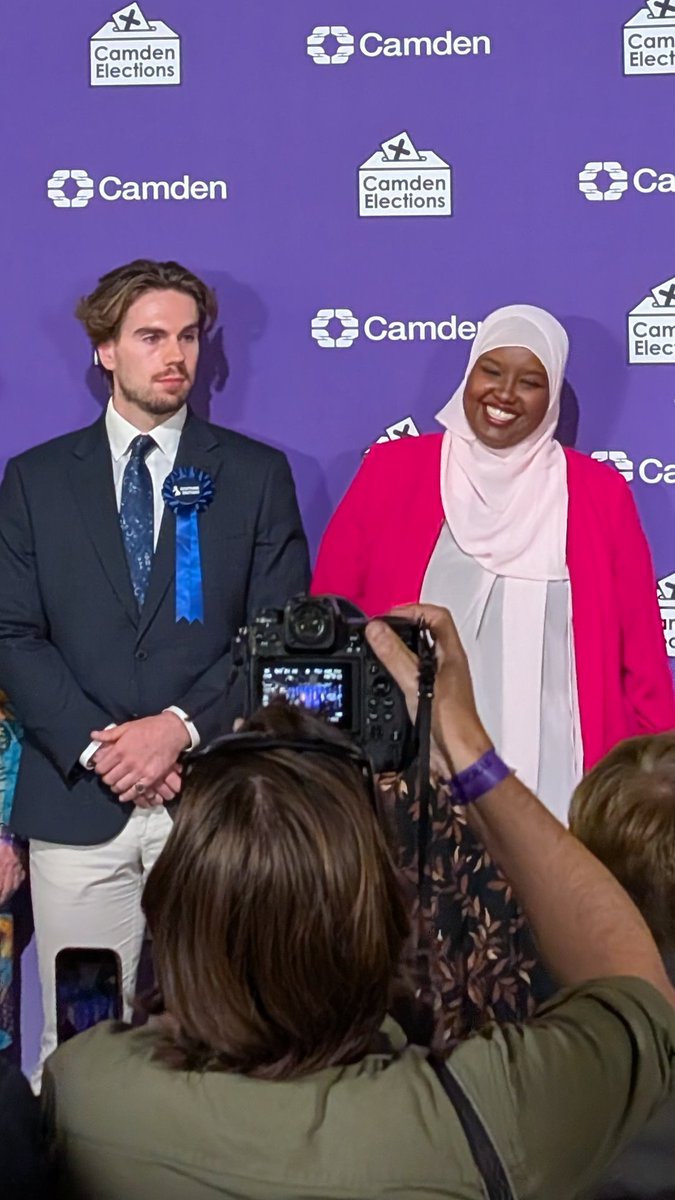 gingerrtom's tweet photo. If you needed a laugh this morning, here's Sagal Abdi-Wali standing next to Restore Britain’s Tyler Johnson after being elected as the new MP for Holborn and St Pancras.

Sensational viewing!🤣🤣🤣🤣🤣 https://t.co/6I5kVU3zLr
