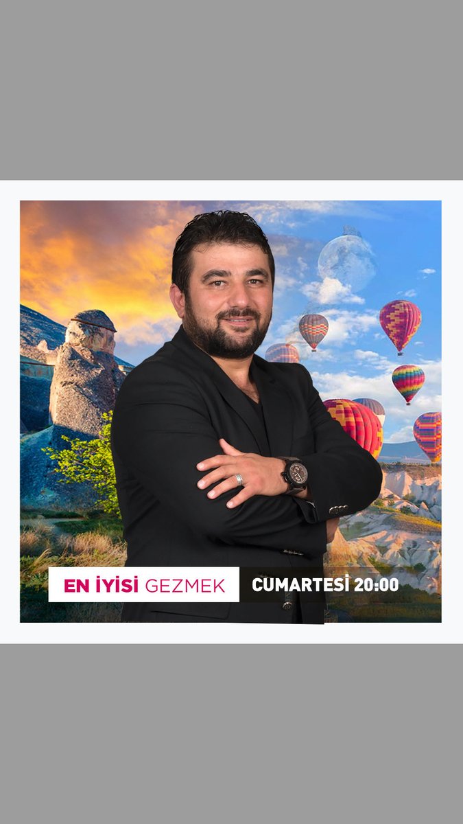 Promotional poster featuring a smiling bearded man in a black suit with arms crossed, set against a backdrop of Cappadocia's hot air balloons, advertising "EN İYİSİ GEZMEK CUMARTESİ 20:00".