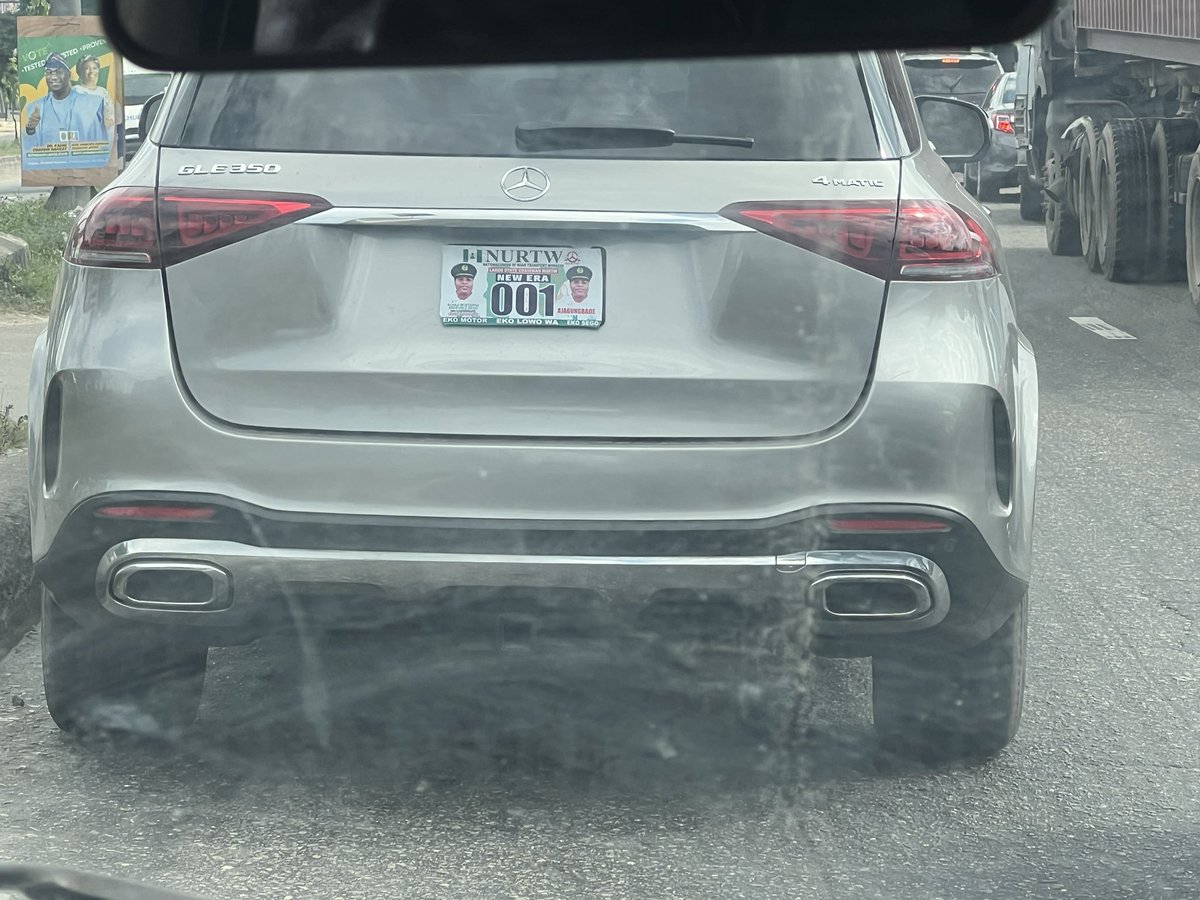 afrisagacity's tweet photo. I spotted the Chairman of Lagos Agberos's car on one of Lagos’ roads, and I was amazed by the wealth and power he wields!

Alhaji Mustapha Adekunle, popularly called “Sego,” rides in a brand-new GLE 350 with an escort. His plate number carries his name, picture, and “official” title.

If I hadn't seen his plate number, given how they cleared the traffic for him, I would have thought he was a senior government official.

How he navigated into different lanes with dangerous speed and zoomed off arrogantly when the traffic cleared proved the power he wields. No one dared overtake his convoy. 

And as he disappeared into the far distance, with his ghastly troubles, a painful thought settled in my troubled mind and stayed for several minutes. It dawned on me that these are the people who decide our future.

I have to ask, can a Professor in Nigeria today, who has dedicated over 20 years of his life contributing immensely to Nigeria’s tertiary institutions, afford Mr Sego’s car? Can a teacher in any Nigerian school ever afford a quarter of the amount the car was bought for, even if they teach for 30 years?

Then the painful reality hit me - Nigeria is a broken, dysfunctional society that rewards “antigens.” How can Nigeria thrive when it generously rewards Agberos (thugs) over its most creative, saving brains in critical sectors such as medical, academic, law, security, etc?

Nigeria’s dysfunctional society can only favour people like “Sego,” whom I consider the machinery the political elite use to sustain the status quo. Think a little genuinely, and you'd see that this is the reality across Nigeria. 

Rascality rules and rewards the rascal, the illegal, the impune, the thug.  The very opposite is what hard-working creative minds in our critical sectors get.

MC Oluomo can employ tens of Nigerian Professors and feed them, easily. Tompolo earns more money than some states make from IGR and more money than can pay thousands of Nigerian military officers dedicating their lives to protecting Nigeria and defending her territorial integrity. 

Asari Dokubo is stupendously rich for doing nothing other than constituting a nuisance on camera now and then. Tony Kabaka (born Tony Adun) is among the richest men in Edo State, far more than the celebrated Professor Ambrose Folorunsho Alli can ever imagine, even in his next life.

Take it further; repentant” Boko Haram members get more allocation from the Borno State government than some of the state’s critical sectors. Nigeria’s “officeless” First Lady gets more federal allocation than key ministries like Health. And the list of rascality goes on!

When one sincerely reflects on these issues, one will find that these men have one thing in common - zero productive value! Their jobs add little or zero value to the country. Without them, the society will function even better! What this proves is that we run a ruinous dysfunctional system that can ONLY lead us to destruction.

While I congratulate Mr Sego on the large lifestyle the gods of impunity have blessed him with, I only wish that these gods can reward our productive, creative, brains as much as they do for Mr Sego and his like, if not much more.✍️
