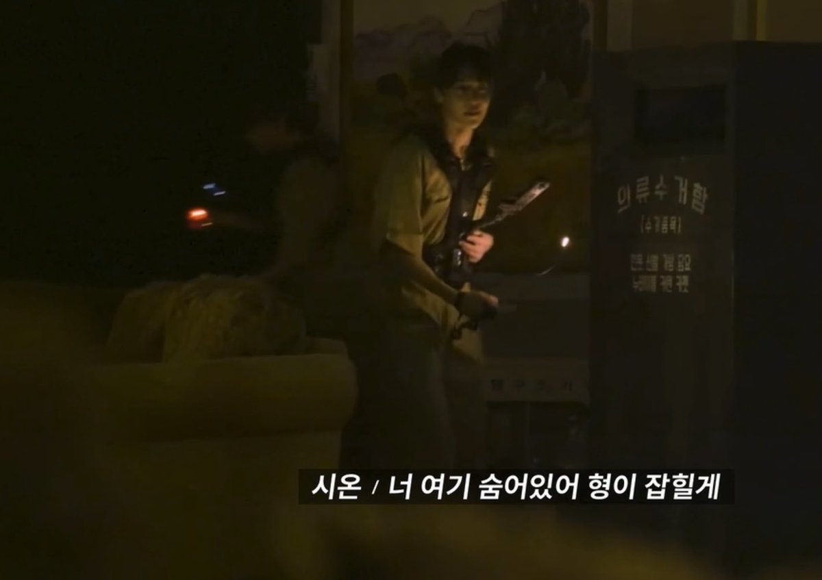 A young man holding a sword stands in a dimly lit setting beside a coffin with Korean text, including the label "익투수 귀환" and a subtitle reading "시온 / 너 여기 숨어있어 형이 잡힐께" (Zion: You hide here, I'll get caught), echoing the post's sentiment about a reassuring line spoken in a terrifying place.