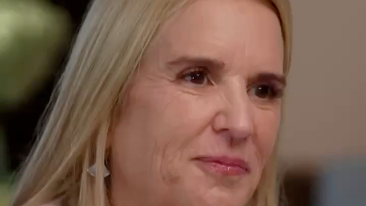 A close-up of a blonde woman with a concerned expression, appearing to be from a television interview.