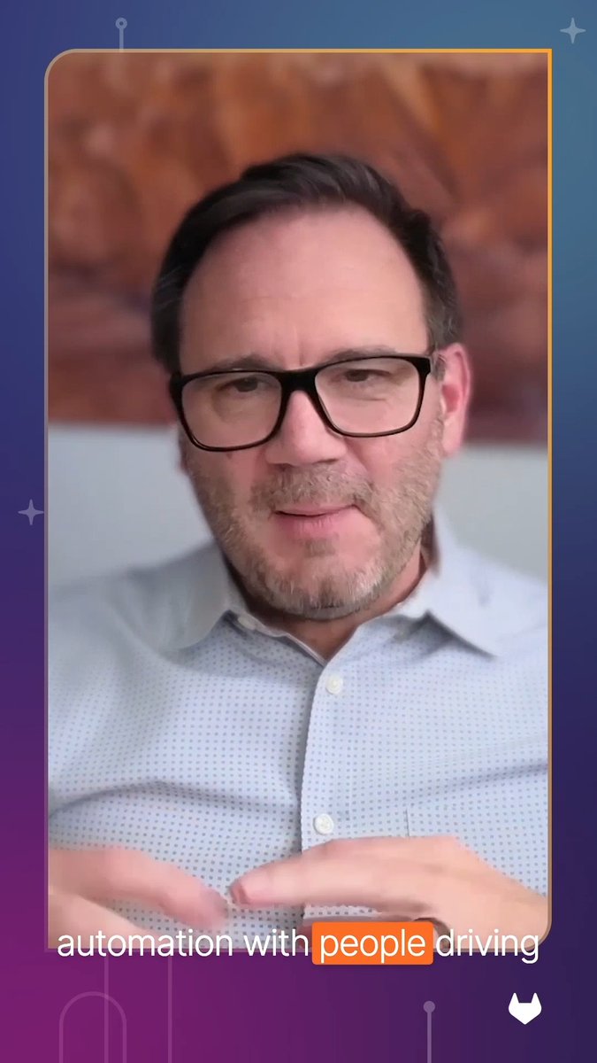 Screenshot from a video of a bearded man wearing glasses speaking, with the caption 'automation with people driving' displayed at the bottom.