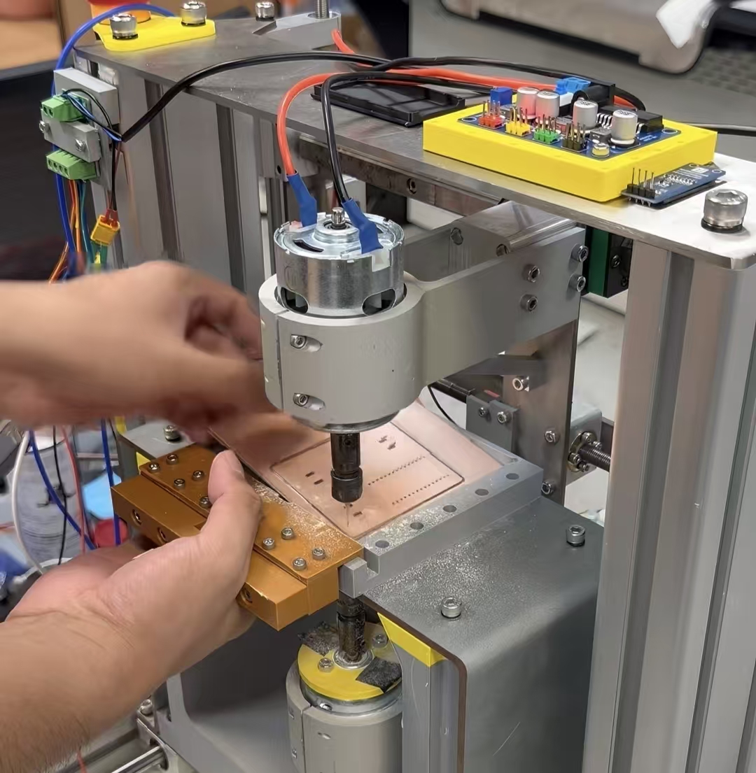 IterxAI's tweet photo. What if you could build a piece of hardware just by describing what you want?

That's the idea behind IterxAI, or 词元开物.

We've seen AI turn simple prompts into websites, apps, and working code. But what about physical devices? What if you could go from an idea to a real circuit board without spending days learning different tools?

That's what we're building IterxAI to do.

Let's try something simple: I want to make a Snake game.

I start with just that one sentence. IterxAI asks a few questions to figure out what I need, then turns my idea into a set of product requirements. It also selects suitable components from its built-in library and brings their functions and connections together in one project.

Next, it generates the code for the game. I can even simulate the code online to see how it runs before moving on to the hardware.

Now comes the interesting part: the PCB.

IterxAI can generate the circuit board design and automatically route the connections. If I want to make changes, I can open the visual editor and move things around, much like drawing on a canvas.

Once the design is ready, I can generate the manufacturing files and send them to a desktop PCB printer.

The printer mills the circuit traces, drills the holes, and cuts out the board. It can even work on both sides of the PCB, giving us more room to build.

And in about ten minutes, we can turn a digital design into a physical circuit board.

Think about what that changes.

Normally, building a hardware prototype means switching between design software, writing code, preparing manufacturing files, and waiting for a board to arrive. If something goes wrong, you may have to repeat the whole process.

With IterxAI and a desktop PCB printer, much of that process can happen right on your desk. You can make a change, print another board, and test it again.

And once we connect the power, the project comes to life.

It started with one sentence. Now, we have a real piece of hardware in our hands.

That's what IterxAI is all about: making hardware creation more accessible, so more people can turn their ideas into things they can actually build.

We're IterxAI, and we're making hardware creation something more people can experience for themselves.