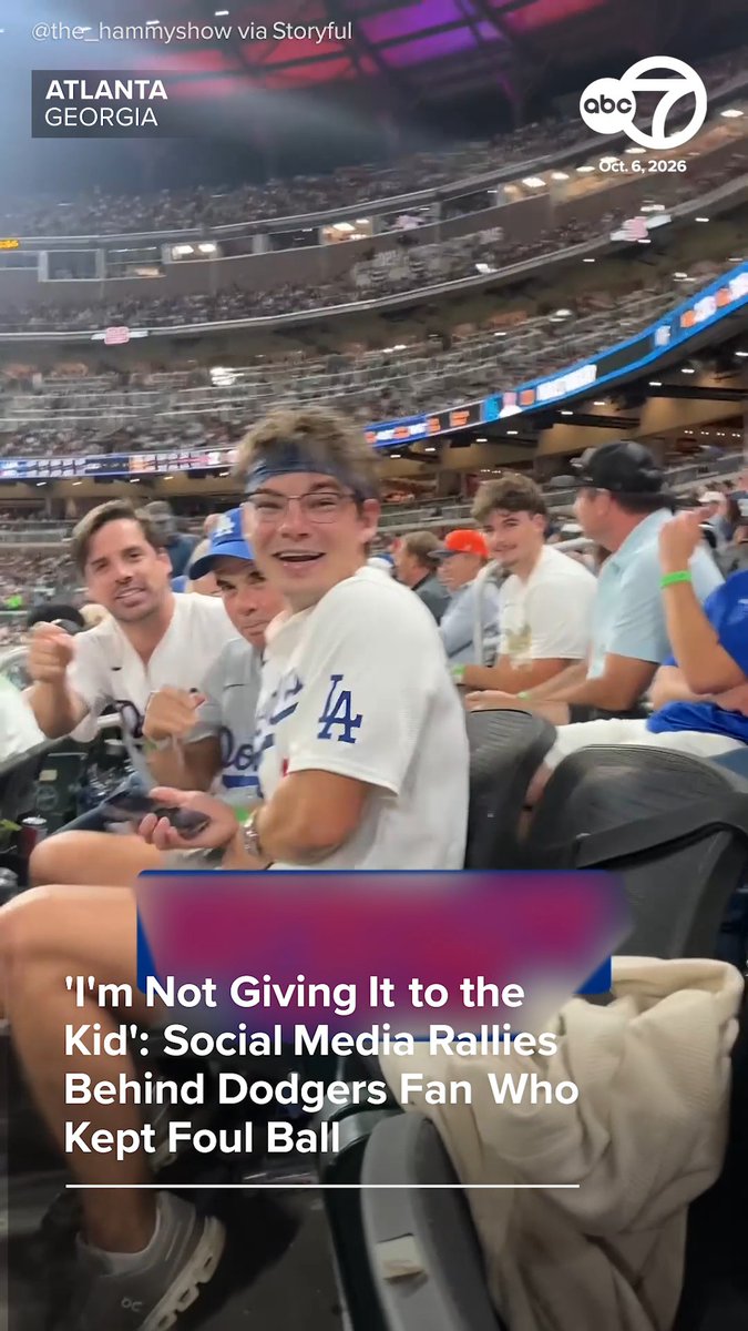 A screenshot from ABC7 news dated Oct. 6, 2026, shows a Dodgers fan smiling at the camera while seated at an Atlanta, Georgia stadium, with the headline "'I'm Not Giving It to the Kid': Social Media Rallies Behind Dodgers Fan Who Kept Foul Ball." The image captures the viral moment referenced in the article, depicting the fan at the center of the foul ball controversy surrounded by other spectators.