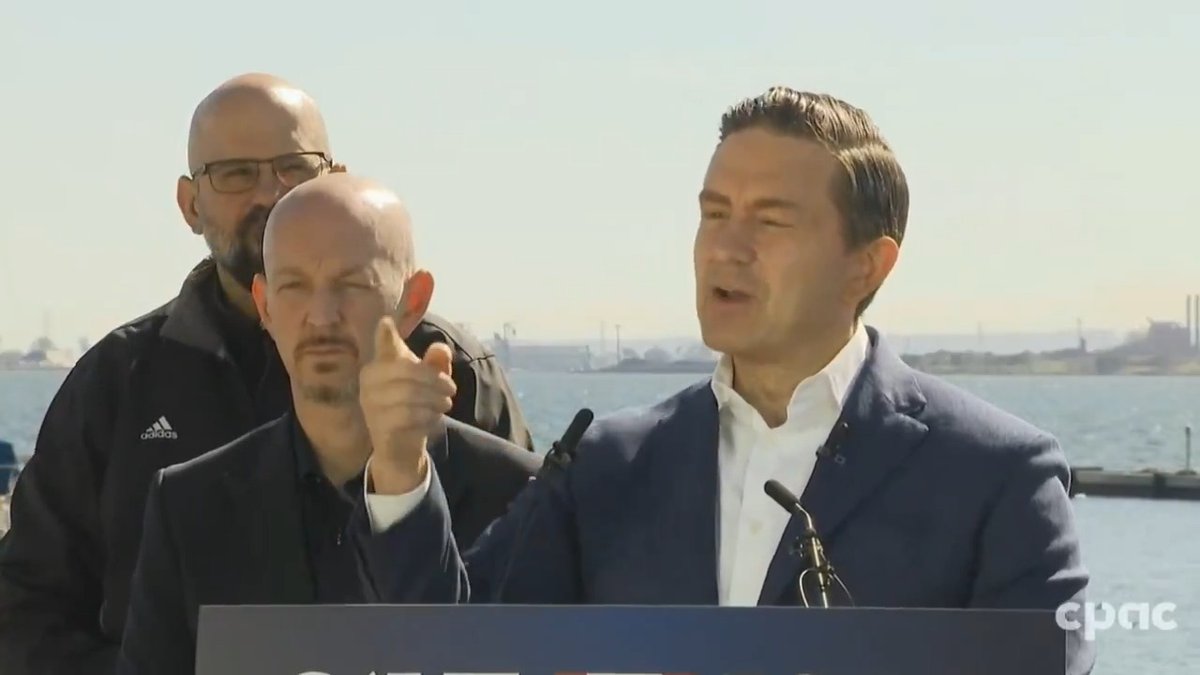 Pierre Poilievre, the Canadian Opposition Leader, speaks at an outdoor podium with a waterfront and industrial skyline behind him, gesturing emphatically while flanked by two aides, as the post criticizes the press for targeting him while giving Liberal Leader Mark Carney a pass despite Canada's economic struggles.