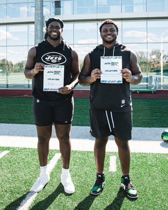 Two New York Jets players hold "I Play For" placards in the Jets Official Catch campaign, dedicating their play to loved ones — embodying the post's message of representing something bigger than the game.