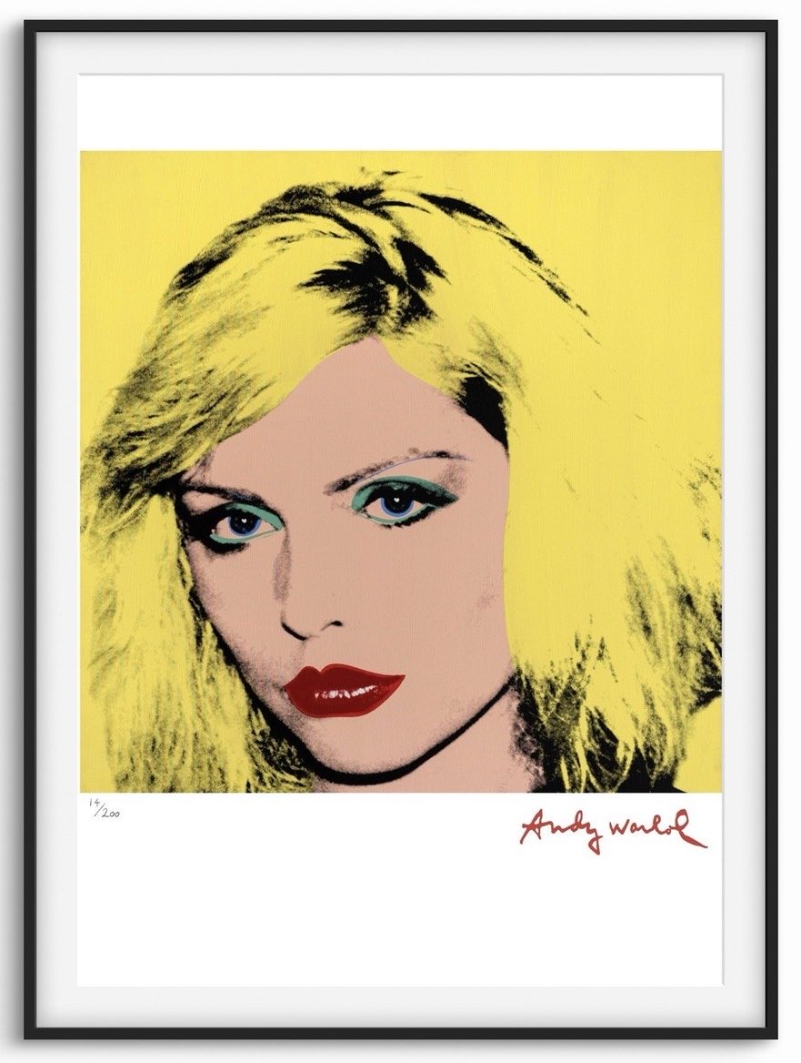 Picturethis74's tweet photo. Happy Saturday everyone 💛Details magazine (1987)

“Let’s sit here,” Debbie said after the coffee had dissolved, and took me into a front room that had comfortable seating in its center, away from the things piled against the walls. Actually on the walls were large Andy Warhol paintings of electric chairs that Andy – a longtime friend – had given Chris. There were other Warhols that had been given to them both, and some they had bought. There was a Warhol of guns against a wall, and a giant framed portrait of Debbie with spikes through her face, painted by sci-fi illustrator H.R. Giger and used for the cover of Koo Koo, her first solo album.
We sat facing each other. I felt uncomfortable but at home in the messy surroundings. “Um,” I said, revealing only the tip of my intelligent iceberg. We both laughed. 💛