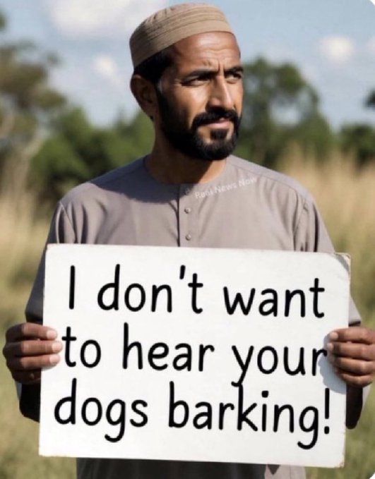 A bearded man wearing a tan cap holding a white sign that reads 'I don't want to hear your dogs barking!'