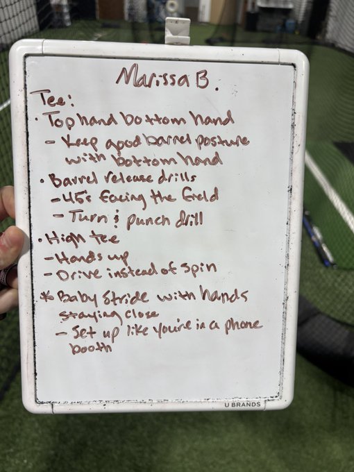 A whiteboard labeled 'Marissa B.' with softball practice notes including tee, barrel release drills, and high tee instructions.